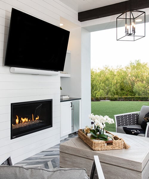 Montigo Phenom fireplace installed in a protected outdoor area
