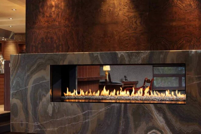 Montigo Exemplar R620ST fireplace shown between a living and dining room