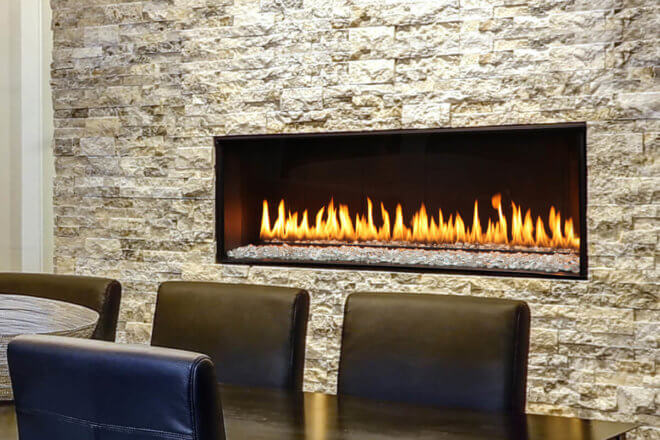 Montigo Exemplar R320 fireplace shown with white facing in a dining room