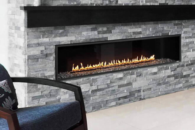 Montigo Exemplar R720 fireplace shown with grey ledgestone facing