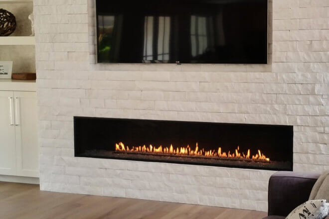Montigo Exemplar R820 fireplace shown with white brick facing in a modern room