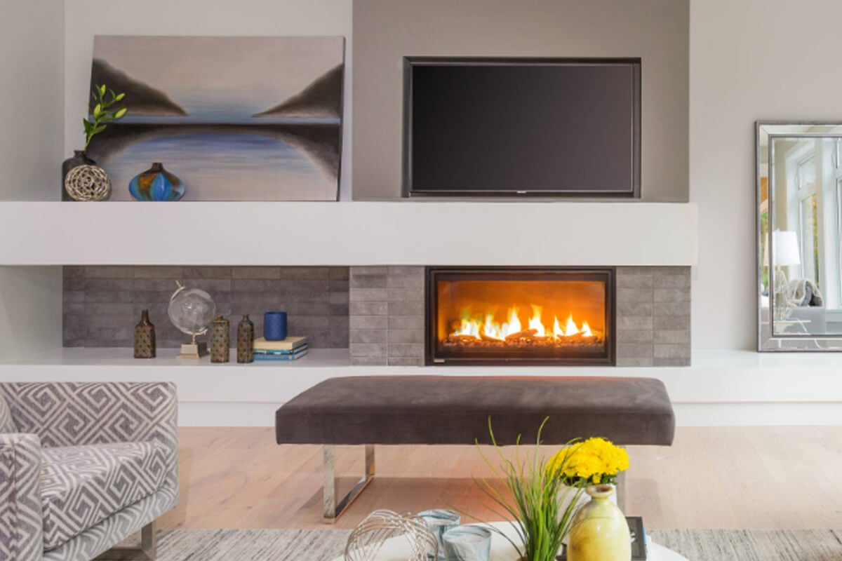 Phenom fireplace shown in a tile surround, tv above