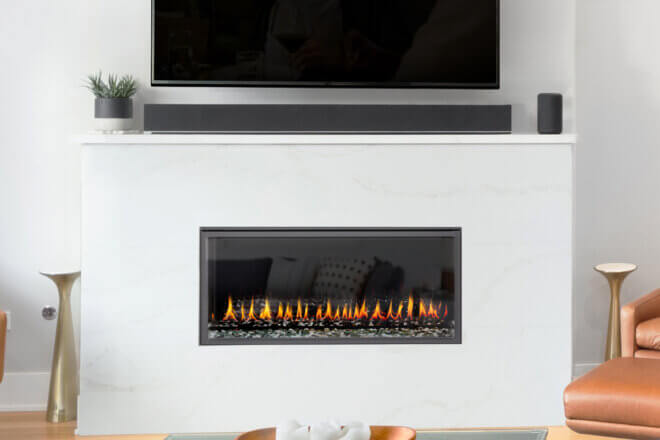 Montigo Exemplar R320 fireplace shown with white stone facing