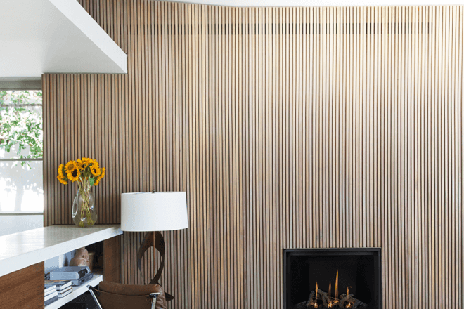 Hiding the fireplace heat release with vertical slats